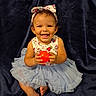 baby, child, toddler, smiling, happy, portrait, sitting, dress, tutu, headband, bow, red_ball, toy, barefoot, dark_background, velvet, indoor, cute, facial_expression, photography