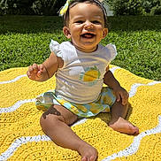 Aria joined the competition — help win amazing prizes! baby, child, smiling, happy, outdoor, portrait, sitting, blanket, yellow_blanket, grass, garden, backyard, trees, sunlight, bow, headband, infant, clothing, barefoot, nature