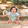 baby, child, smiling, happy, outdoor, steps, greenery, hat, romper, sitting, feet, face, cute, one_year, wood, decor, portrait, daylight, infant, playful