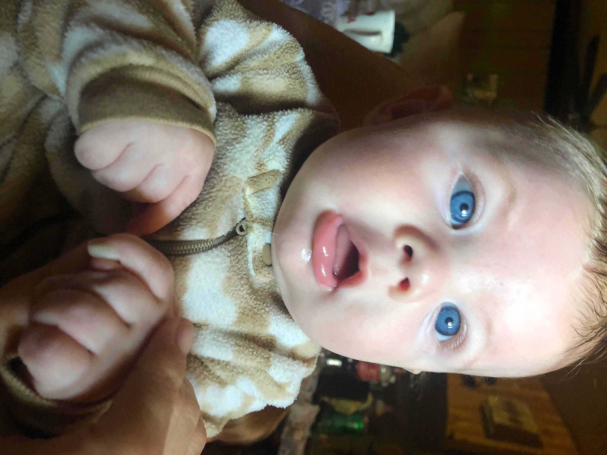 Timber is registered to the contest to win money with this photo: baby, baby_toddler_clothing, cheek, child, close_up, ear, eye, eyelash, gesture, human_body, iris, lip, mouth, nail, nose, person, skin, smile, surprise, thumb