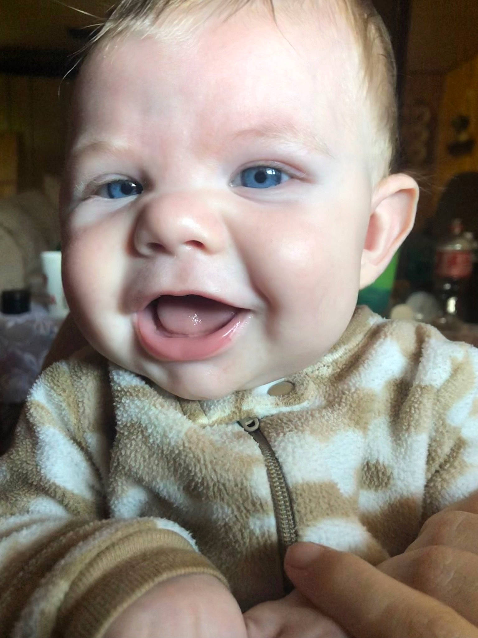 Timber is registered to the contest to win money with this photo: baby, baby_toddler_clothing, cheek, chin, comfort, ear, eyelash, finger, happy, iris, jaw, lip, mouth, nose, person, skin, sleeve, smile, toddler, tongue