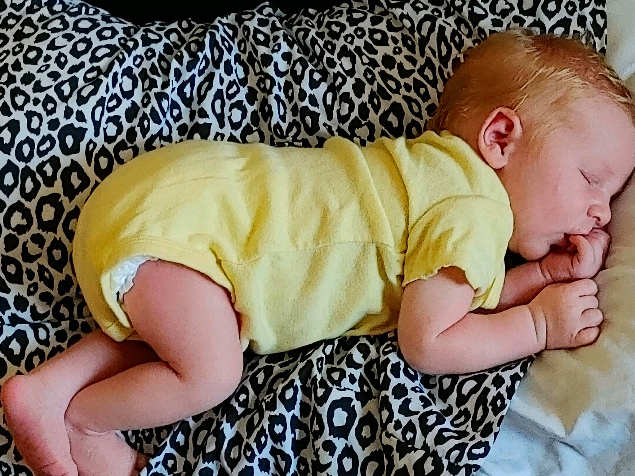 Landyn joined the competition — help win amazing prizes! baby, baby_products, baby_sleeping, baby_toddler_clothing, child, comfort, finger, foot, human_leg, leg, linens, pattern, person, sitting, skin, sleeve, sock, t_shirt, textile, thigh