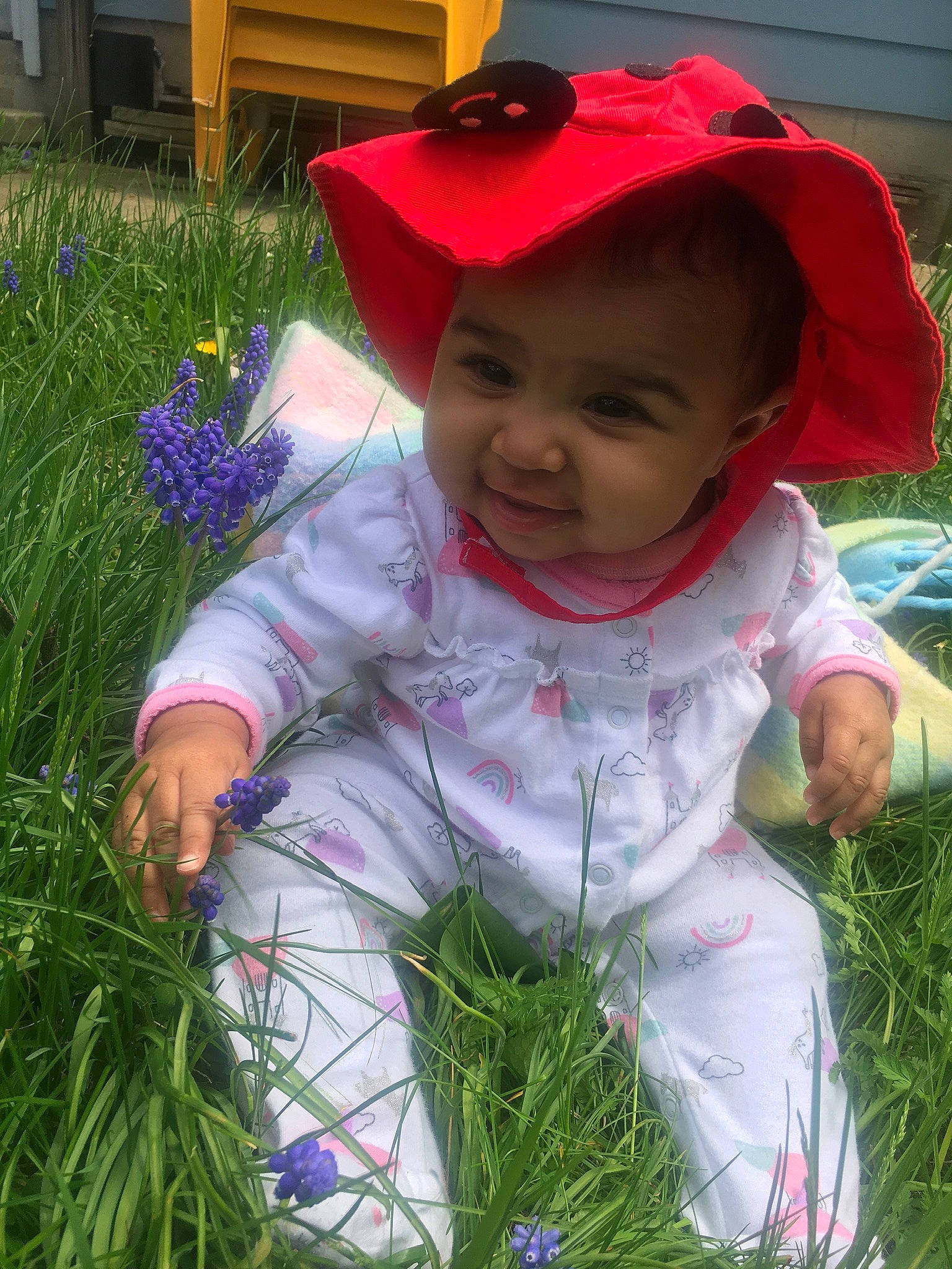 Khalani is registered to the contest to win money with this photo: baby, child, flower, grass, grass_family, headgear, lavender, leaf, outerwear, person, plant, smile, spring, toddler, wildflower