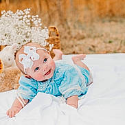Scottlyn joined the competition — help win amazing prizes! baby, infant, blue_dress, headband, bow, blanket, outdoor, grass, bunny, stuffed_animal, portrait, smile, cheeks, eyes, lying_down, basket, flowers, soft_toy, cute, photography