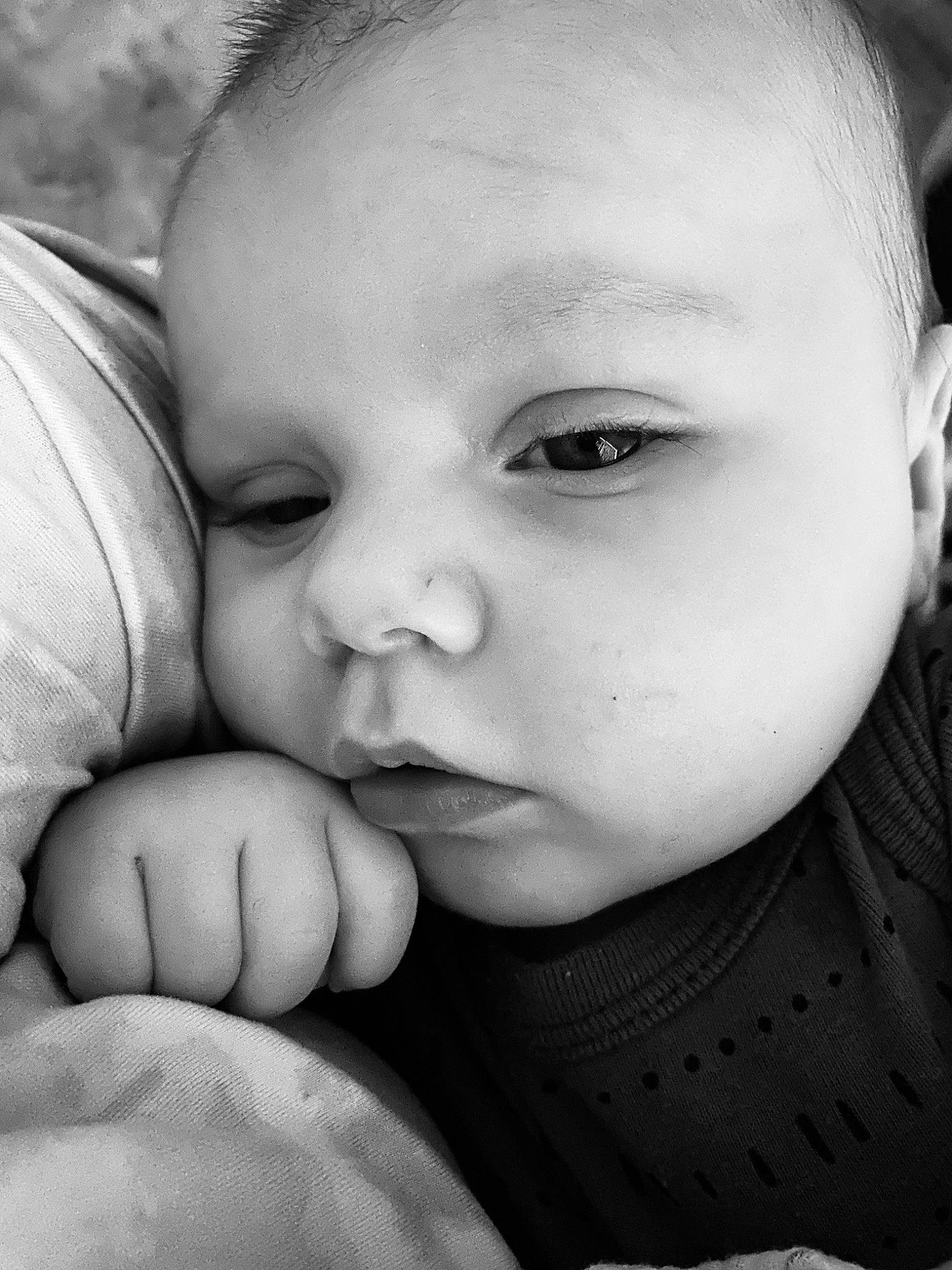 Dean is registered to the contest to win money with this photo: baby, black_and_white, cheek, chin, eye, eyebrow, eyelash, finger, flash_photography, forehead, gesture, hand, happy, iris, lip, mouth, nose, organ, person, skin