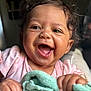 Cimani is registered to the contest to win money with this photo: baby, child, smiling, happy, blanket, indoor, cute, face, baby_clothes, skin, hand, expression, infant, portrait, closeup, young_child, cheerful, toddler, person, human