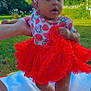 Cimani joined the competition — help win amazing prizes! baby, child, tutu, red_dress, headband, strawberry_pattern, outdoor, grass, sky, blue_sky, hand, blanket, cute, standing, person, infant, summer, daylight, support, portrait