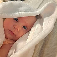 Sylphiette is registered to the contest to win money with this photo: baby, infant, face, eyes, blanket, towel, white, soft, skin, close_up, portrait, cute, child, indoors, bed, comfort, warmth, resting, newborn, wrapped