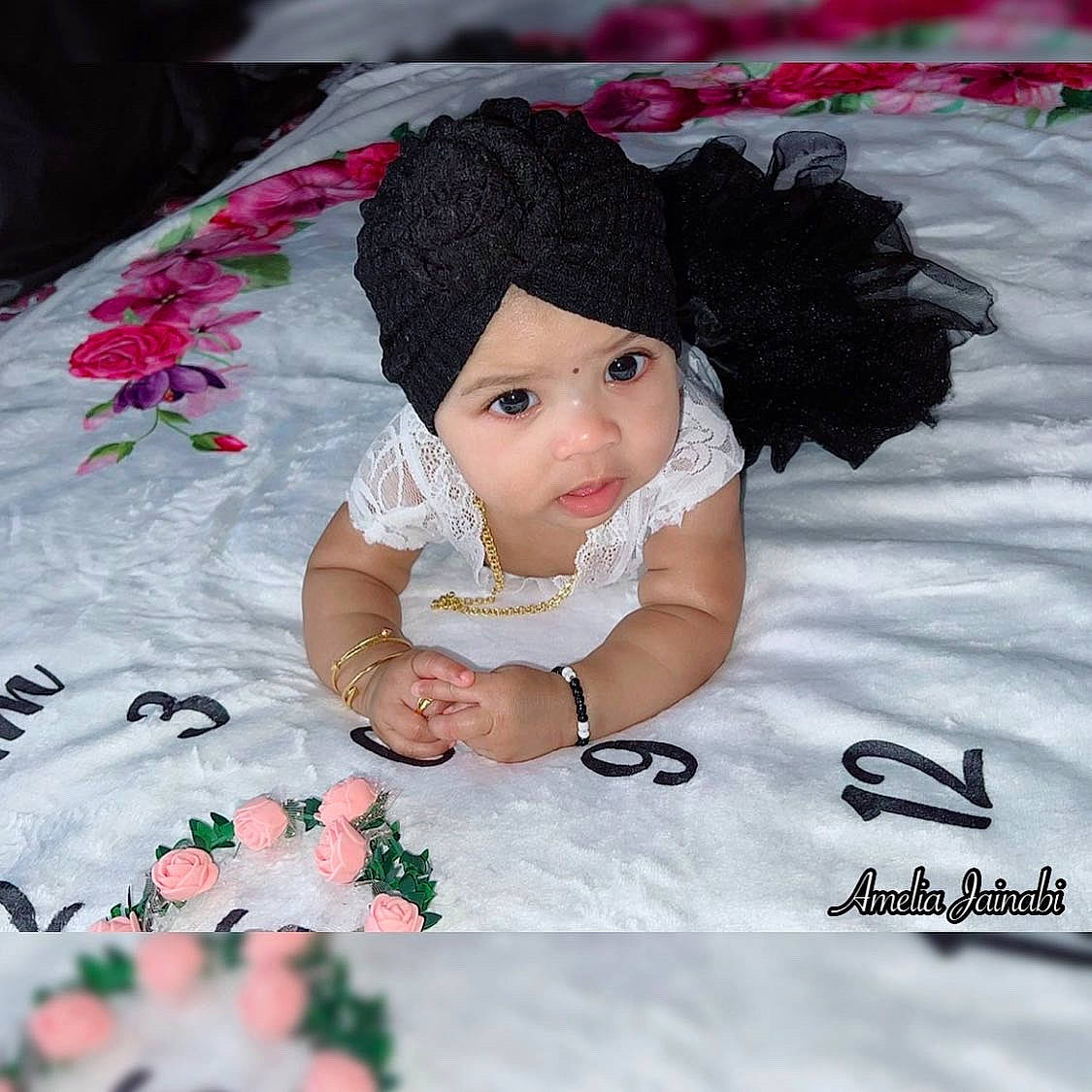 Amelia joined the competition — help win amazing prizes! baby, baby_toddler_clothing, child, dress, eyelash, fashion_accessory, happy, headpiece, headwear, linens, magenta, pattern, person, petal, pink, plant, product, skin, textile, toddler