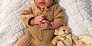 Dylan joined the competition — help win amazing prizes! adorable, baby, baby_clothing, bear_ears, blanket, bracelet, child, cozy, cute, hand_holding, indoors, infant, knitted_outfit, lying_down, plush_toy, portrait, smiling, soft_texture, teddy_bear, warm_colors