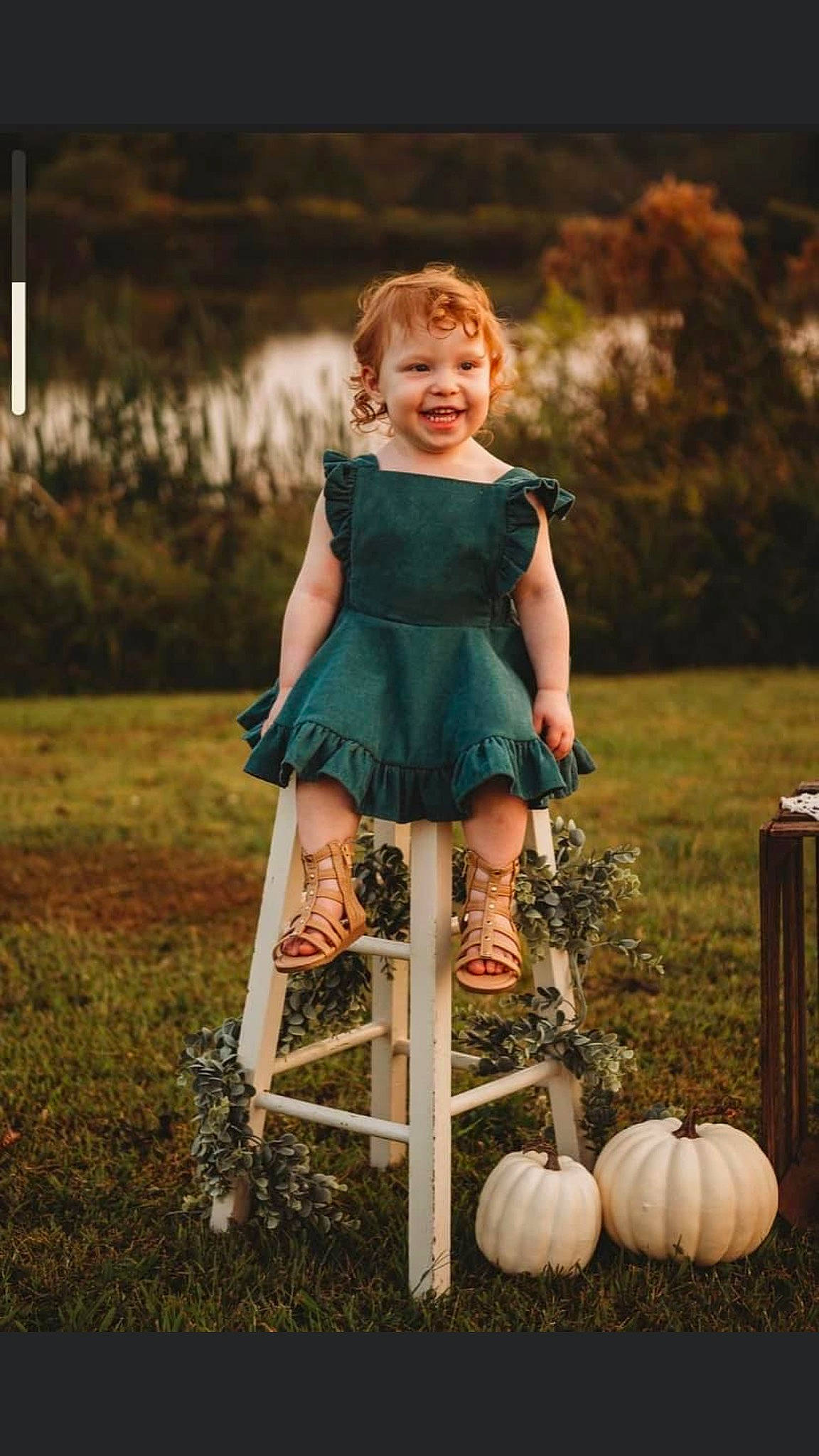 Sophia is registered to the contest to win money with this photo: blond, calabaza, chair, cucurbita, dress, eye, flash_photography, gourd, grass, hair, happy, head, joy, people_in_nature, person, plant, pumpkin, shorts, sitting, toddler