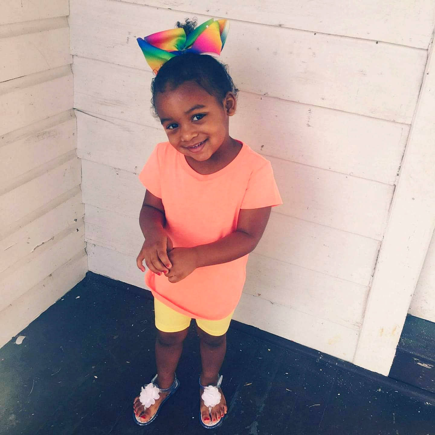 Talaysia is registered to the contest to win money with this photo: child, cool, costume, ear, face, happy, head, joy, person, pink, play, shoe, smile, sportswear, standing, t_shirt, toddler, vacation, yellow