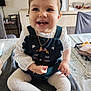 Aerys participe au concours pour gagner de l'argent avec cette photo : baby, child, clothing, cozy, cute, face, gold_chain, happy, headband, home, indoor, infant, jewelry, person, portrait, sitting, smiling, table, tablecloth, white_tights