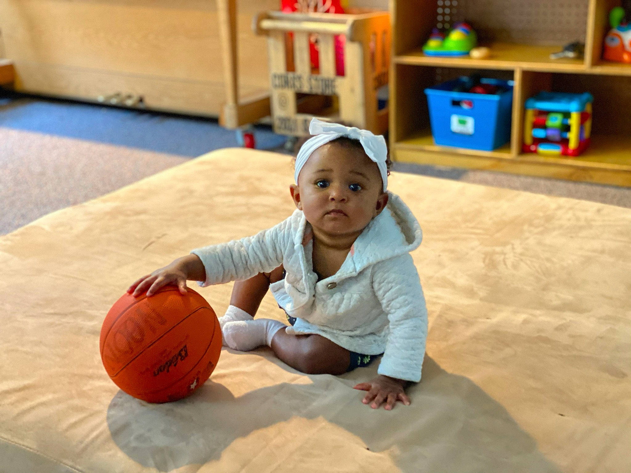 Zeadrianna is registered to the contest to win money with this photo: ball, child, floor, flooring, fun, leisure, person, play, sitting, toddler