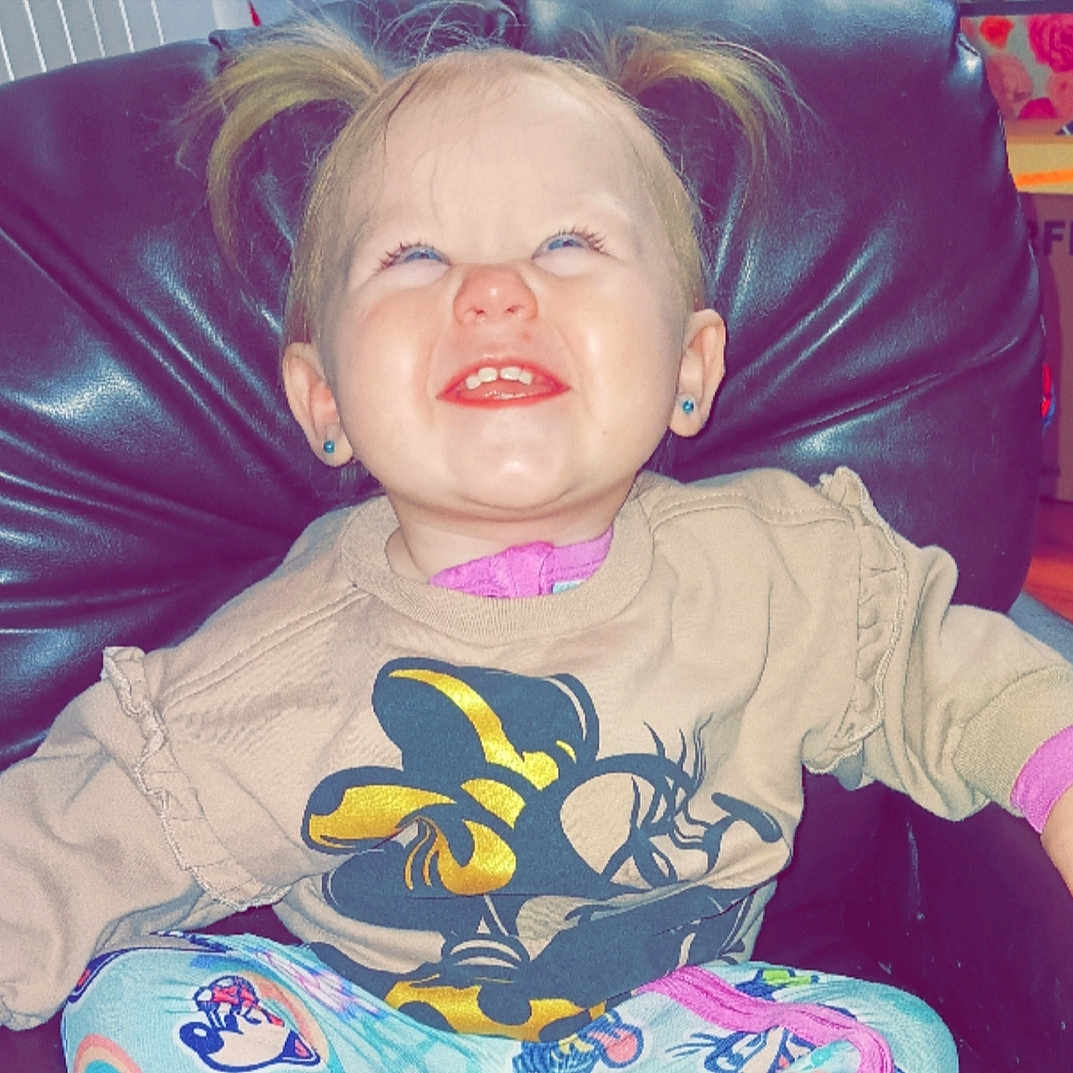 Haizleigh is registered to the contest to win money with this photo: baby, bodypart, chair, clothing, couch, cushion, face, frown, furniture, happy, head, homedecor, laughing, mouth, person, photography, portrait, smile, t_shirt, teeth