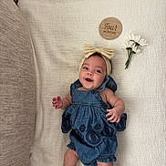 Lilah joined the competition — help win amazing prizes! baby, smiling, blue_dress, headband, bow, blanket, wooden_plaque, flowers, daisies, infant, cute, milestone, four_months, lying_down, socks, happy, portrait, child, indoor, soft_texture