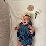 baby, smiling, blue_dress, headband, bow, blanket, wooden_plaque, flowers, daisies, infant, cute, milestone, four_months, lying_down, socks, happy, portrait, child, indoor, soft_texture