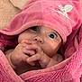 adorable, baby, blue_eyes, child, close_up, cozy, cute, expression, face, hands, hooded_towel, indoor, infant, newborn, pink_towel, portrait, skin, small_hands, soft_texture, wrapped