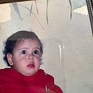 Miral a rejoint le concours — aidez-le/la à gagner de superbes lots ! toddler, child, face, red_sweater, curly_hair, portrait, indoors, expression, looking_away, cute, young_child, person, photograph, nostalgic, old_photo, wear_and_tear, glare, closeup, head_and_shoulders, casual_clothing