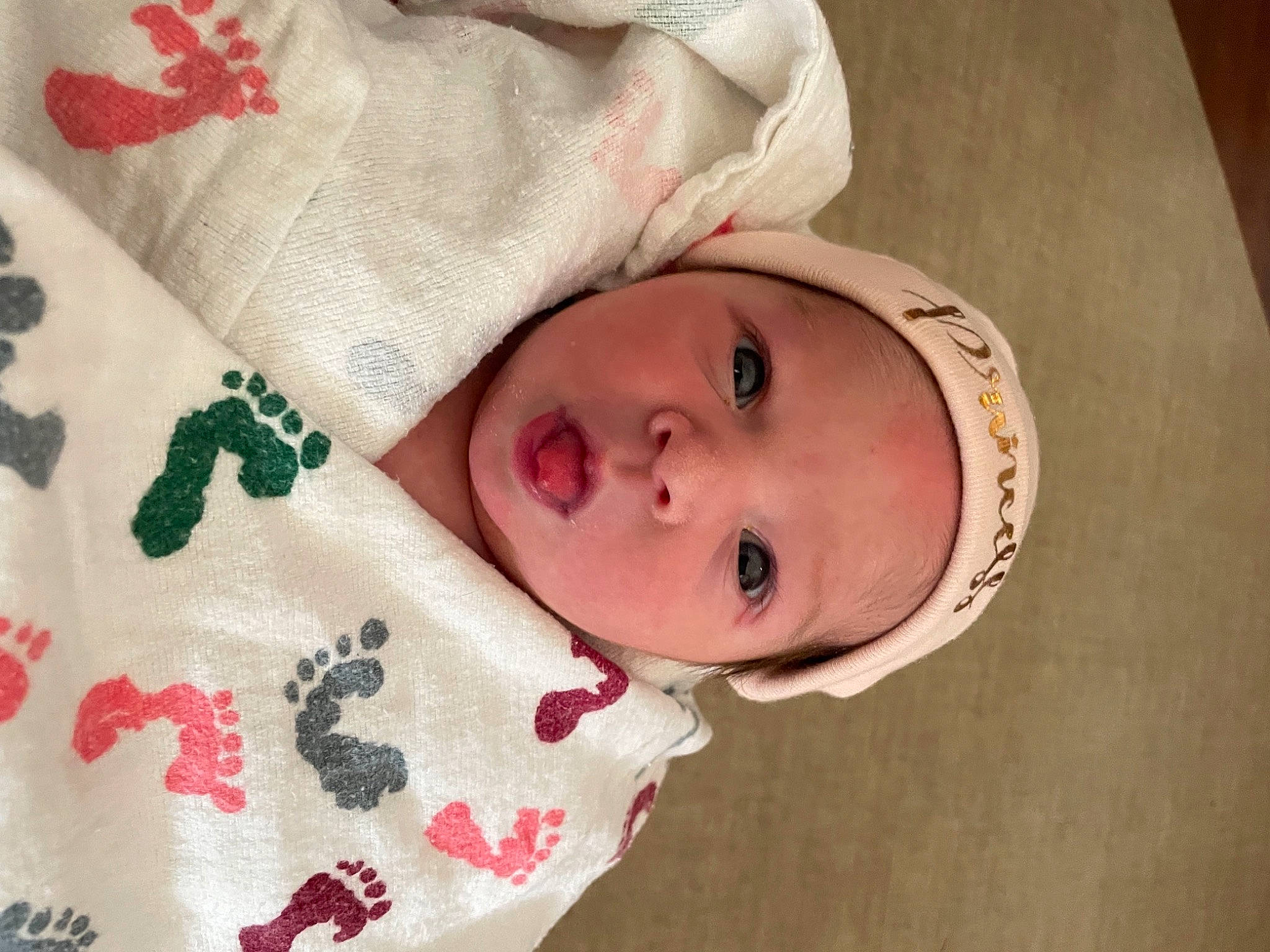 Lilyanna is registered to the contest to win money with this photo: baby, baby_toddler_clothing, cheek, comfort, creative_arts, eye, eyebrow, eyelash, head, headwear, human_body, iris, linens, lip, nose, person, red, skin, sleeve, textile