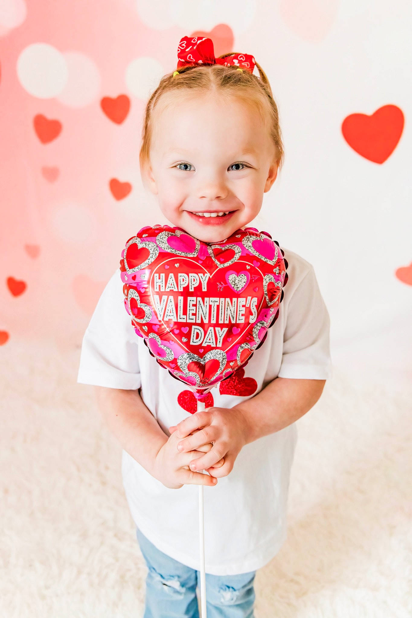 Robin is registered to the contest to win money with this photo: baby, baby_toddler_clothing, dress, eye, face, facial_expression, hairstyle, happy, head, human_body, joy, lip, neck, pattern, person, pink, red, skin, sleeve, smile