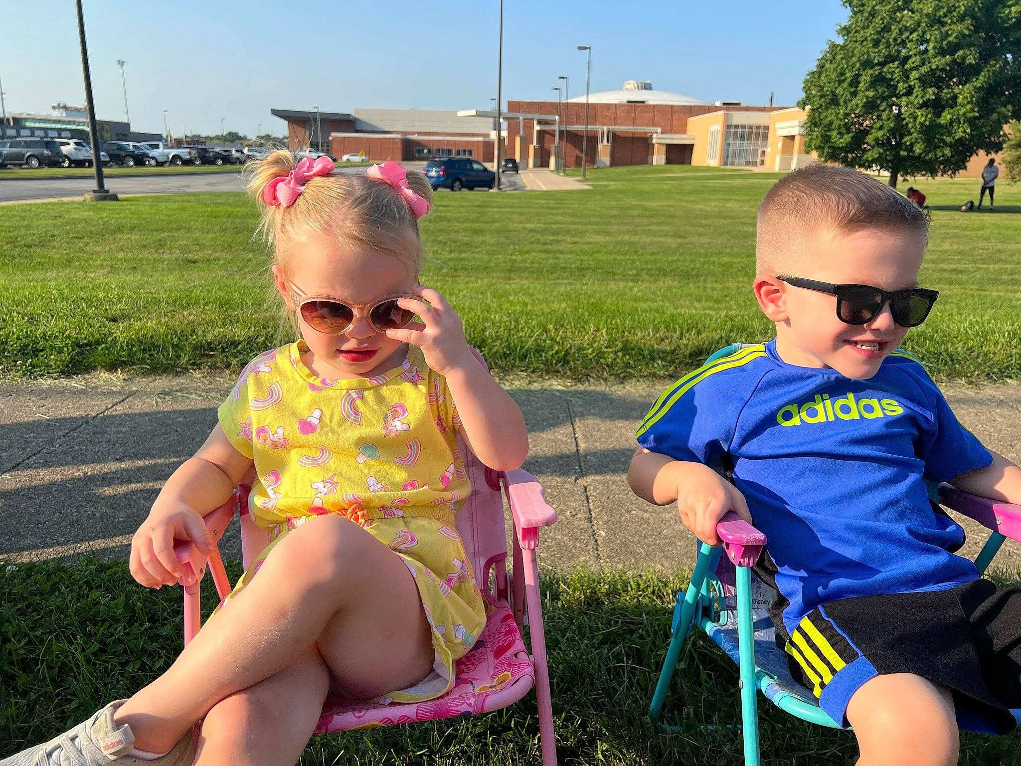 Robin joined the competition — help win amazing prizes! cool, eyewear, fun, goggles, grass, happy, joy, lap, leisure, outdoor_recreation, people, people_in_nature, person, pink, plant, recreation, shorts, sky, summer, sunglasses