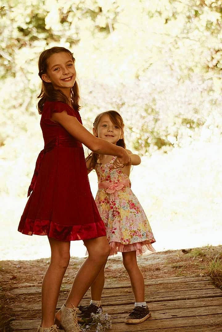 Trinity Amd Emma is registered to the contest to win money with this photo: day_dress, dress, facial_expression, flash_photography, formal_wear, friendship, fun, gesture, grass, hair, hairstyle, happy, human_body, joy, leg, one_piece_garment, people_in_nature, person, shoulder, smile