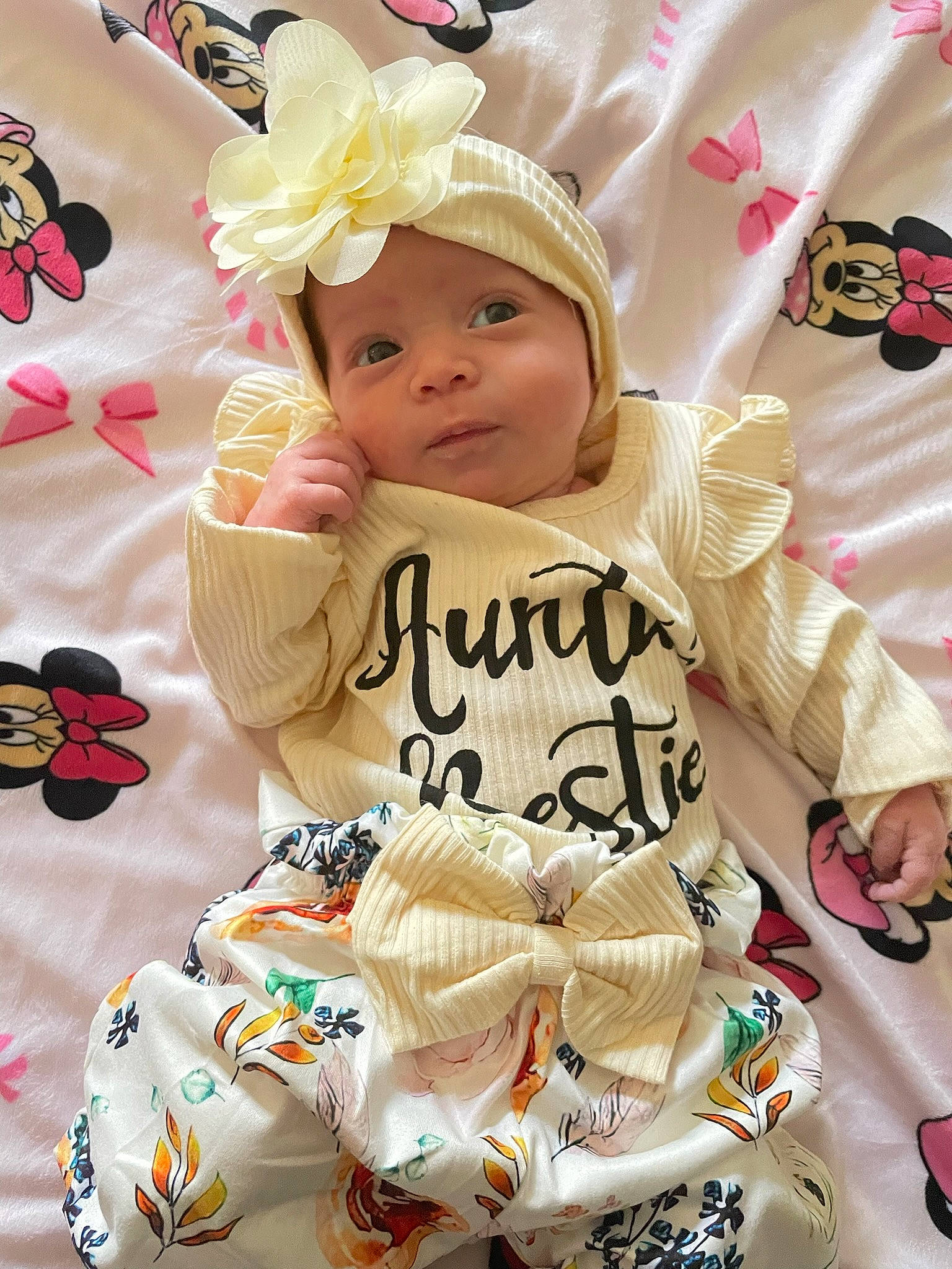 Serenity is registered to the contest to win money with this photo: baby, baby_products, baby_toddler_clothing, cap, cheek, child, event, fashion_accessory, happy, headwear, linens, pattern, person, petal, pink, product, sitting, sleeve, t_shirt, textile