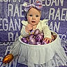 Raegan is registered to the contest to win money with this photo: baby, child, purple_bow, easter_eggs, basket, white_tulle, blanket, purple, curious, cute, indoors, portrait, face, hand, sitting, toddler, decorative_eggs, fabric, headwear, smiling