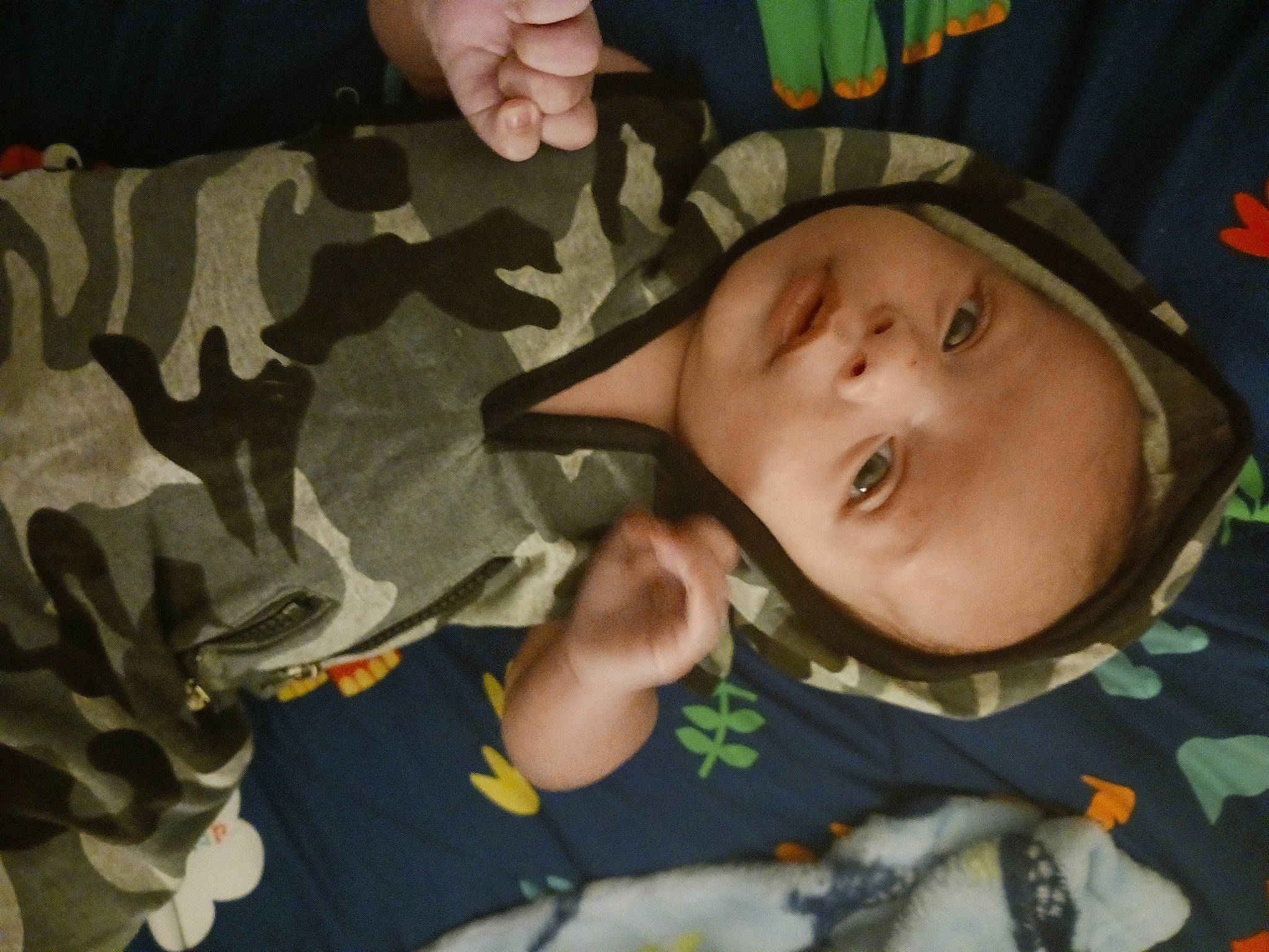 Braxtyn joined the competition — help win amazing prizes! baby, baby_products, baby_toddler_clothing, camouflage, cheek, child, comfort, eye, fun, gesture, head, military_camouflage, military_uniform, mouth, nose, pattern, person, room, thumb, toddler