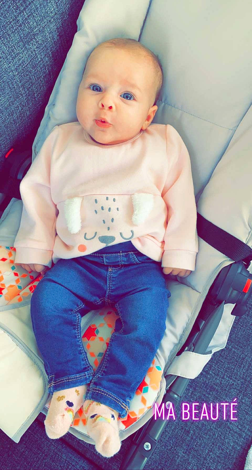 Charlie participe au concours pour gagner de l'argent avec cette photo : arm, azure, baby, baby_toddler_clothing, beauty, cheek, child, comfort, denim, doll, electric_blue, person, pink, product, sitting, skin, sleeve, t_shirt, thigh, toy