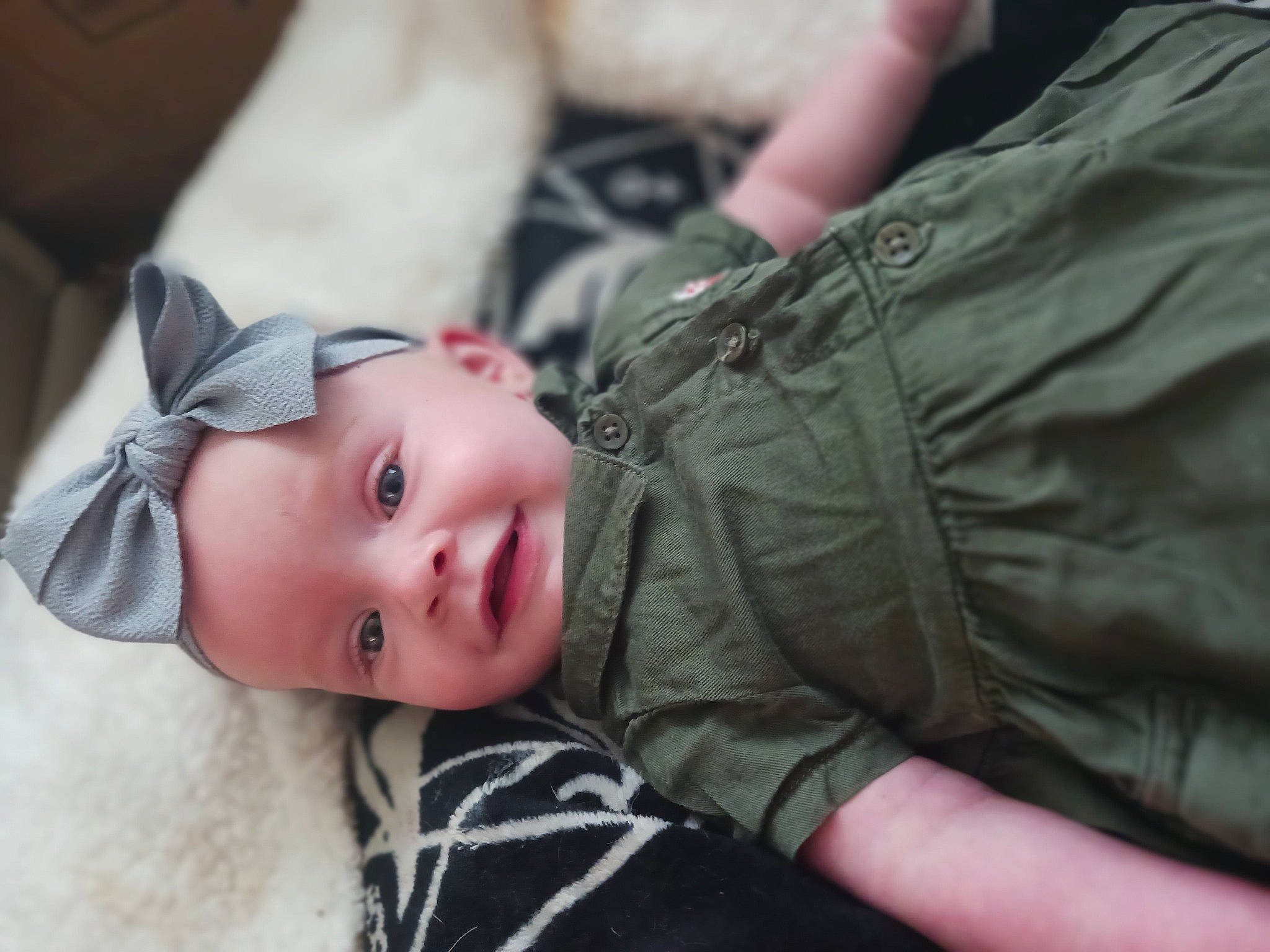 Anastasia is registered to the contest to win money with this photo: abdomen, child, denim, eye, finger, flash_photography, fur, gesture, grass, grey, happy, head, human_body, person, sitting, skin, smile, toddler, tree, window