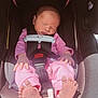 newborn, baby, car_seat, sleeping, pink_pajamas, pacifier, infant, child, safety_harness, footwear_absent, indoors, soft_light, peaceful, evenflo, shyft_dualride, cute, small_hands, small_feet, resting, portrait