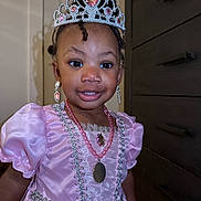 Kaleigh is registered to the contest to win money with this photo: accessory, child, costume, cute, earrings, face, fashion, happy, head, indoor, jewelry, necklace, person, pink_dress, portrait, princess, smiling, tiara, toddler, young_child