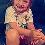 child, smile, chocolate, face, happy, sitting, clothing, tshirt, shorts, bench, indoor, person, cute, young, fun, joy, hair, skin, table, legs