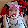 Catalina participe au concours pour gagner de l'argent avec cette photo : baby, infant, pacifier, headband, pink, zebra_pattern, onesie, blanket, red, black, white, cute, child, lying_down, clothing, hand, face, portrait, indoors, comfort