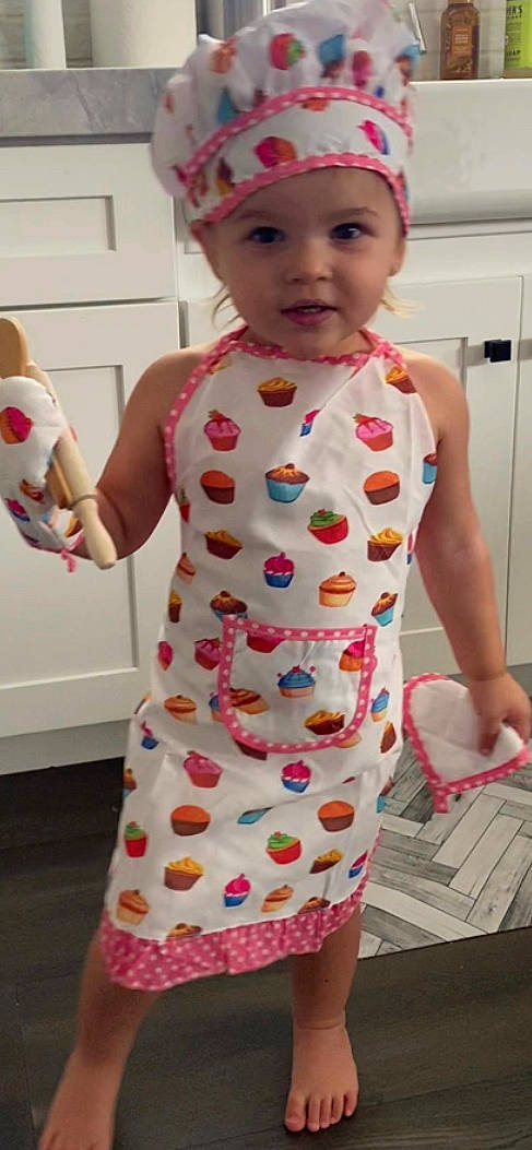 Saylor Grace is registered to the contest to win money with this photo: apron, baby_toddler_clothing, child, clothing, design, dress, headwear, pattern, person, pink, play, polka_dot, textile, toddler