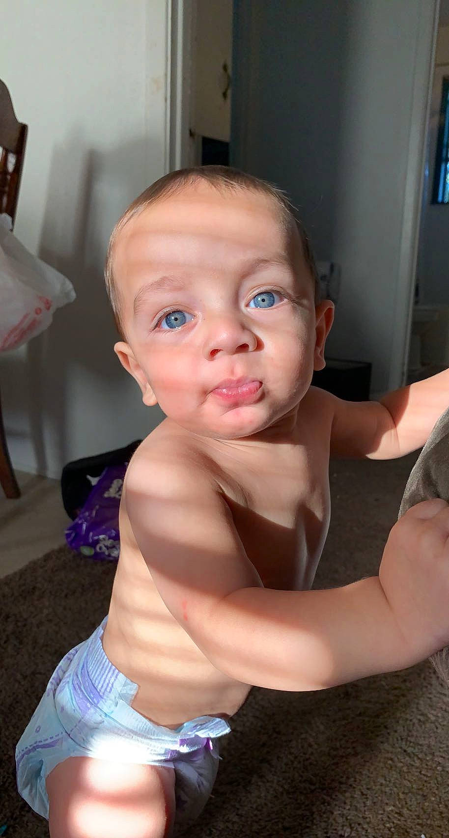 Cannon is registered to the contest to win money with this photo: arm, baby_toddler_clothing, cheek, chest, child, ear, elbow, eyebrow, eyelash, flooring, fun, gesture, hairstyle, hand, mouth, nose, person, skin, thumb, toddler