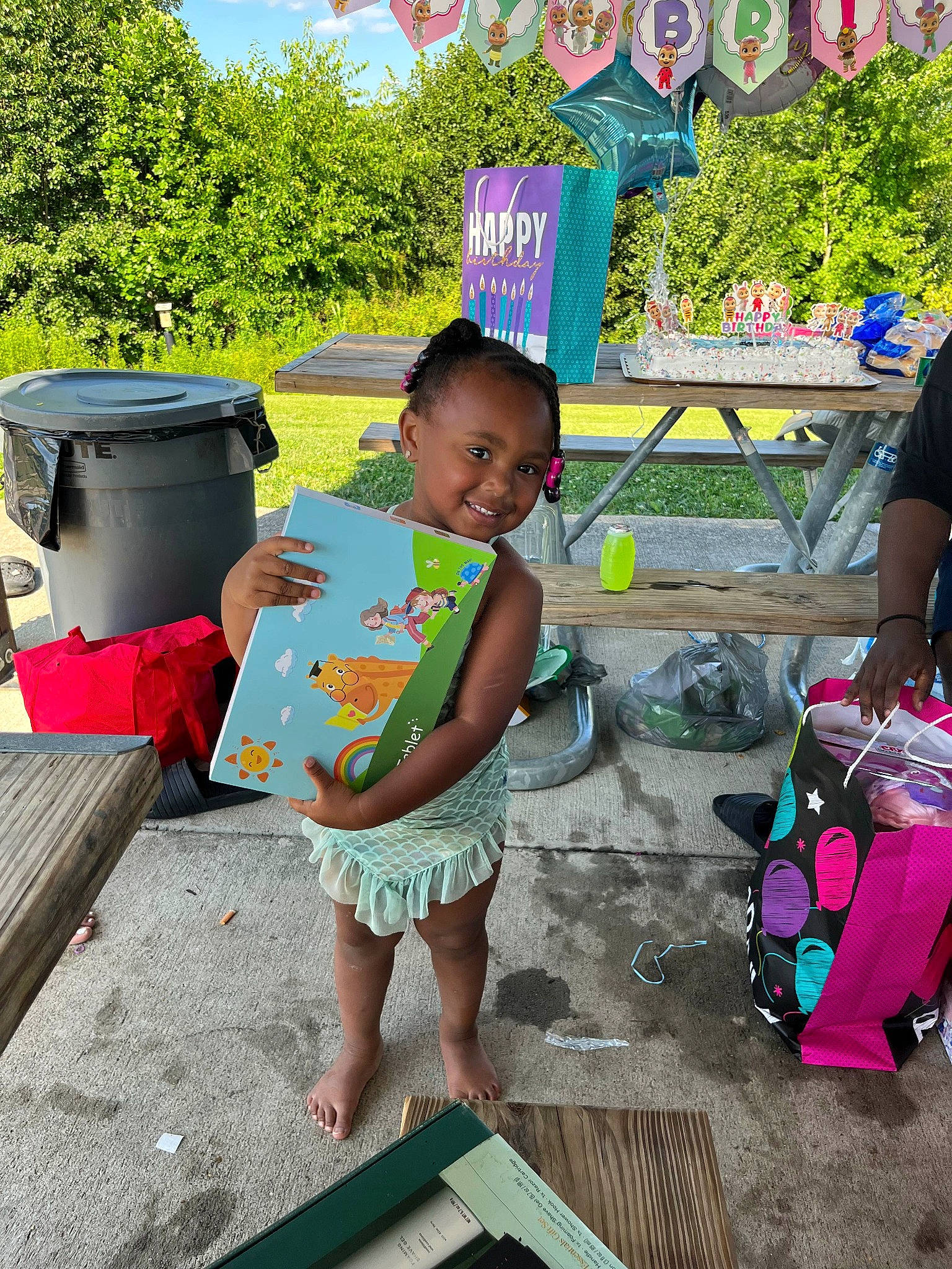 Zyrá is registered to the contest to win money with this photo: child, fun, garden, grass, happy, joy, leisure, luggage_and_bags, morning, person, plant, play, public_space, recreation, shorts, sitting, smile, summer, t_shirt, toddler