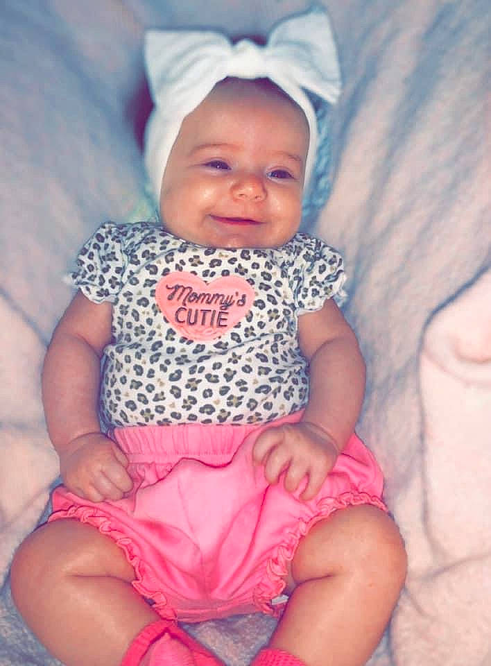 Camdyn is registered to the contest to win money with this photo: azure, baby, baby_toddler_clothing, child, comfort, cool, face, finger, happy, head, headwear, iris, mouth, organ, person, photograph, pink, purple, skin, sleeve