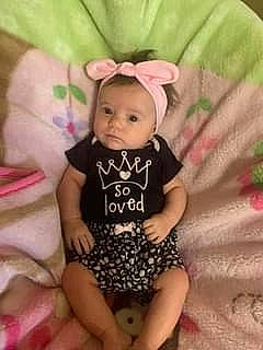 Camdyn is registered to the contest to win money with this photo: baby, baby_products, baby_toddler_clothing, cheek, child, comfort, finger, happy, human_leg, linens, magenta, pattern, person, pink, shorts, sitting, skin, sleeve, t_shirt, thigh