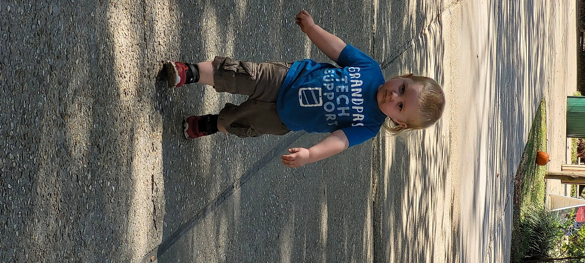 Elijah joined the competition — help win amazing prizes! asphalt, child, concrete, fun, happy, human_leg, leisure, pedestrian, person, play, recreation, reflection, sand, shadow, shorts, street, t_shirt, toddler, walking_shoe, water