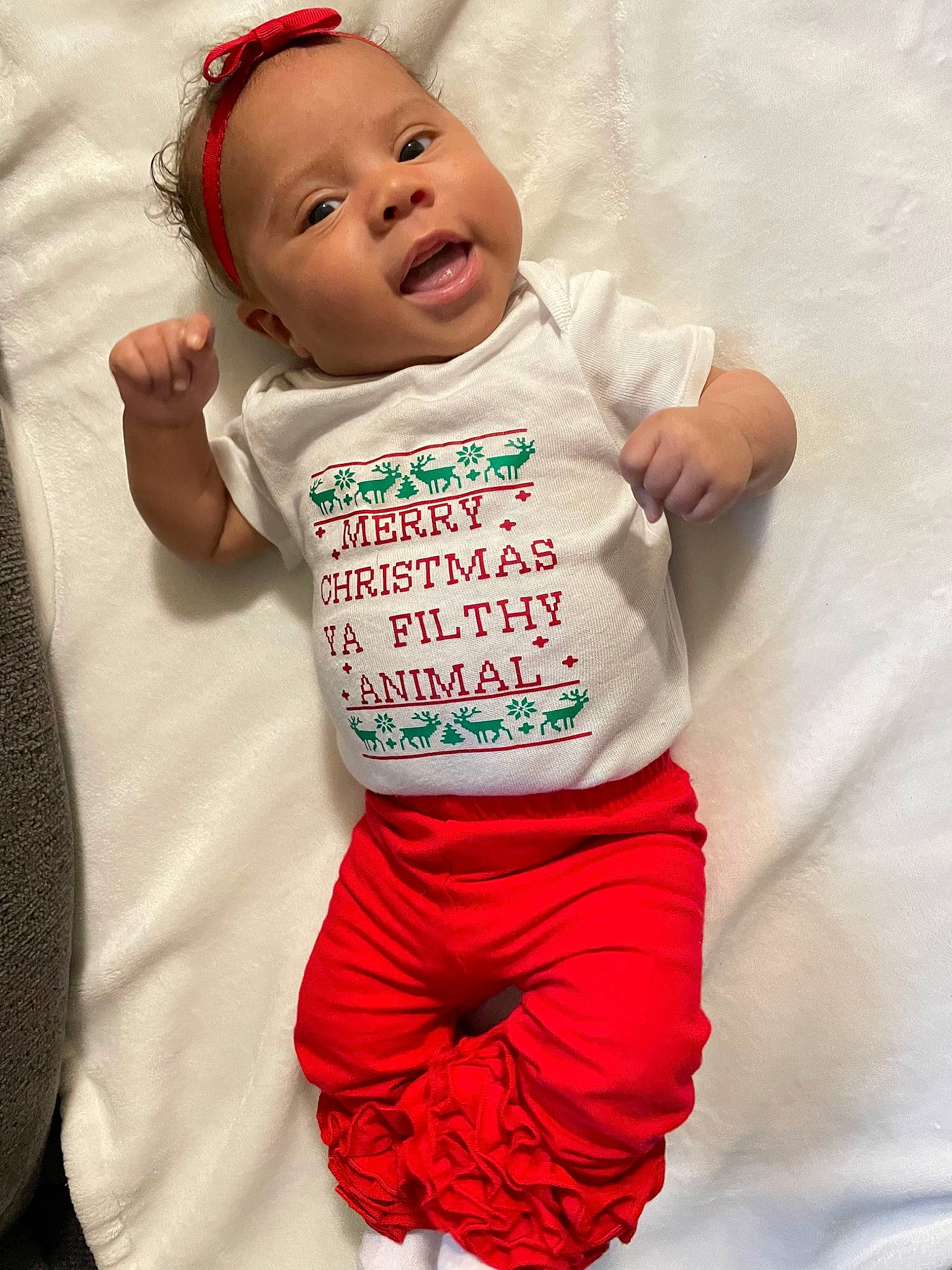 Zalaya is registered to the contest to win money with this photo: arm, baby, baby_toddler_clothing, child, comfort, face, fun, hand, happy, human_body, linens, mouth, neck, person, pink, skin, sleeve, smile, sportswear, toddler