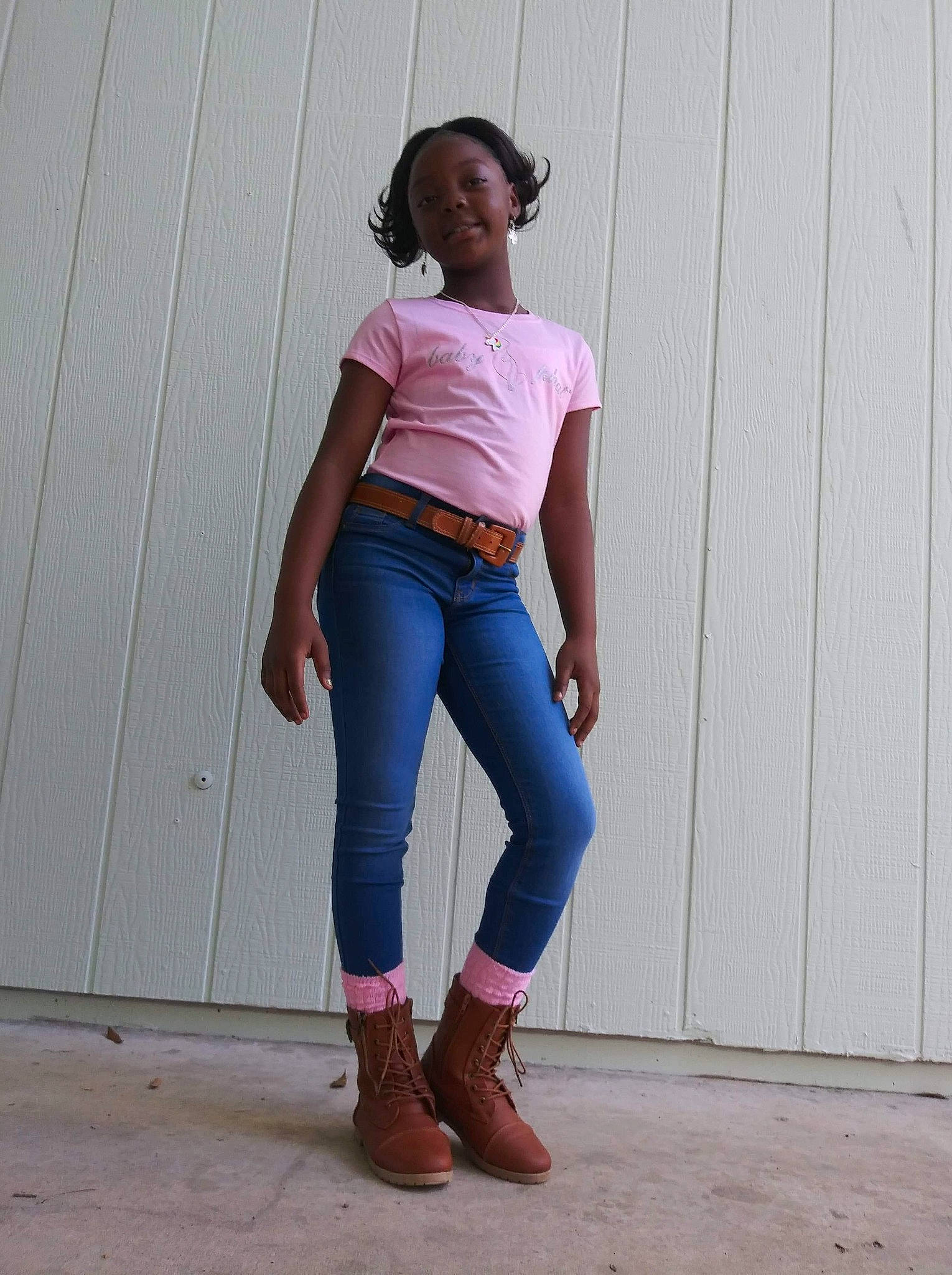 Sa'Kiya is registered to the contest to win money with this photo: brown, clothing, crop_top, denim, fashion, footwear, jeans, joint, knee, person, pink, shirt, shoe, shoulder, sleeve, standing, t_shirt, textile, top, trousers