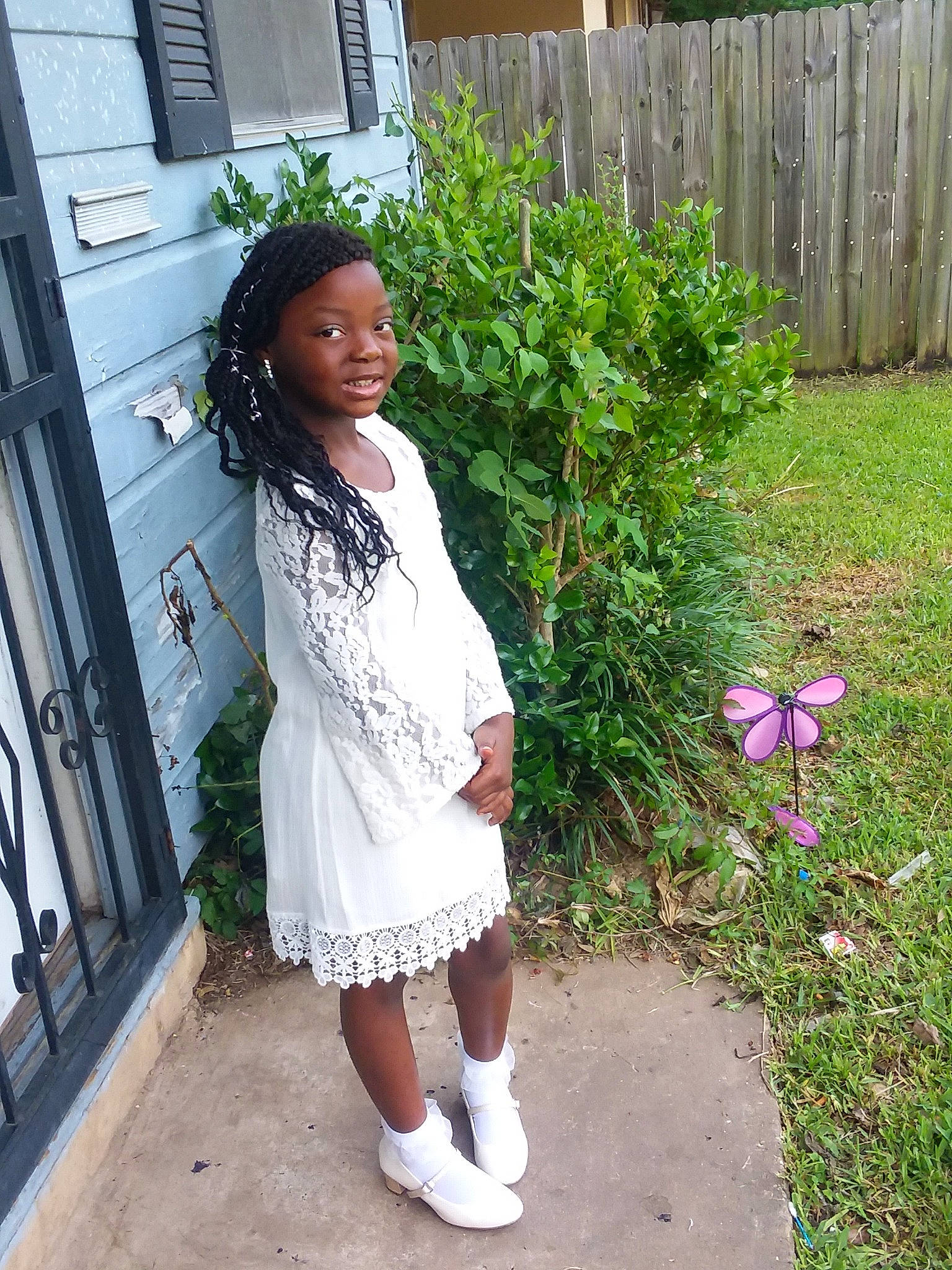 Sa'Kiya joined the competition — help win amazing prizes! backyard, child, dress, flower, footwear, grass, outerwear, person, plant, shoe, yard