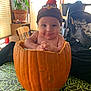 autumn, baby, chair, child, costume, cute, decor, face, festive, hands, hat, indoor, light, plant, portrait, pumpkin, smile, stroller, tablecloth, window