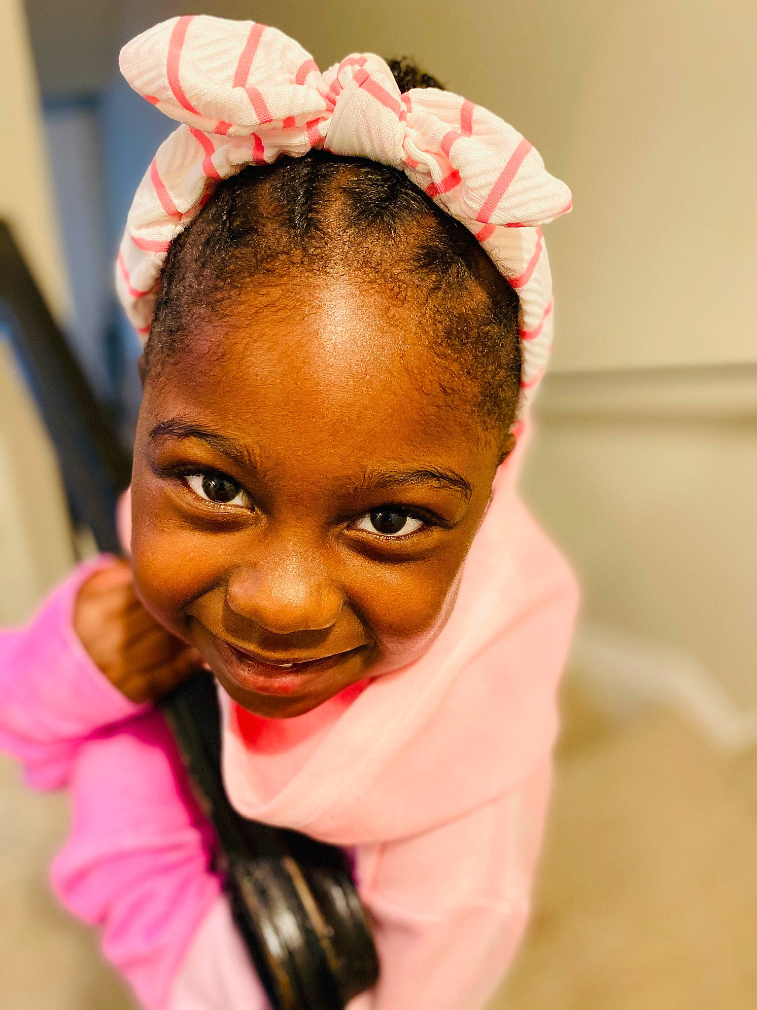 Milan is registered to the contest to win money with this photo: audio_equipment, black_hair, cheek, child, ear, eyebrow, eyelash, forehead, gesture, glove, happy, headpiece, jewellery, joy, lip, magenta, nose, person, pink, skin