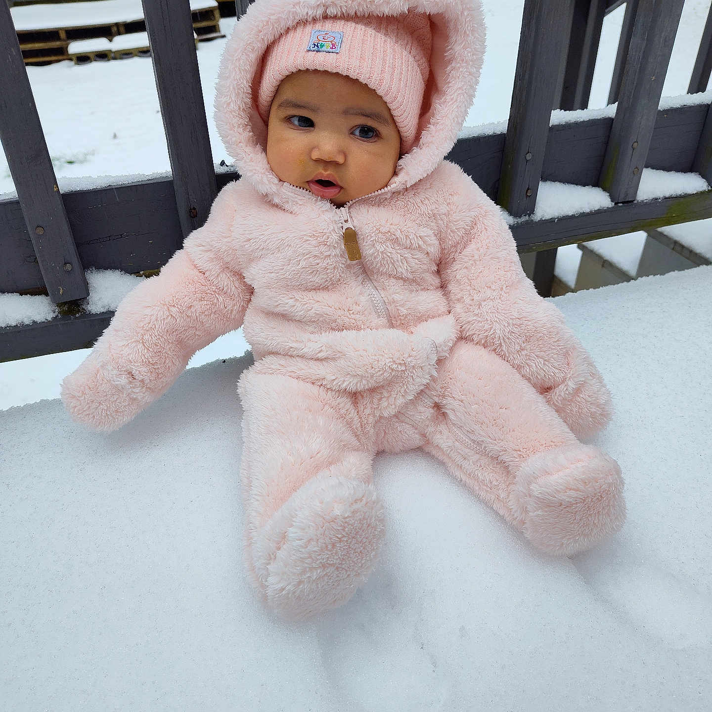 Raelynn is registered to the contest to win money with this photo: baby, beanie, bench, bonnet, cap, clothing, face, furniture, handrail, hat, head, hood, hoodie, knitwear, person, photography, portrait, sweater, sweatshirt, toy