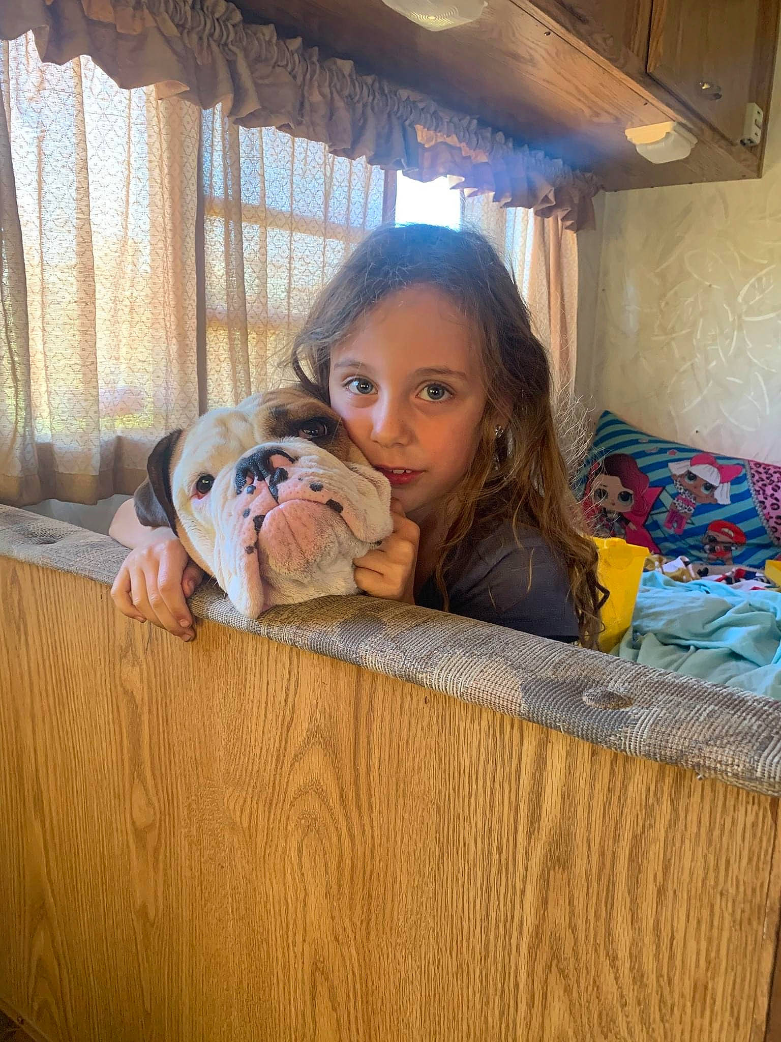 Kara joined the competition — help win amazing prizes! brown_hair, child, comfort, curtain, eye, fawn, floor, flooring, fun, happy, hardwood, human_leg, leisure, long_hair, person, sitting, skin, thigh, toddler, window