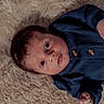 Atlas joined the competition — help win amazing prizes! baby, infant, child, portrait, lying_down, blue_outfit, knitwear, blanket, fluffy_blanket, brown_hair, wide_eyes, facial_expression, hands, fists, indoor, cozy, close_up, soft_lighting, adorable, photography
